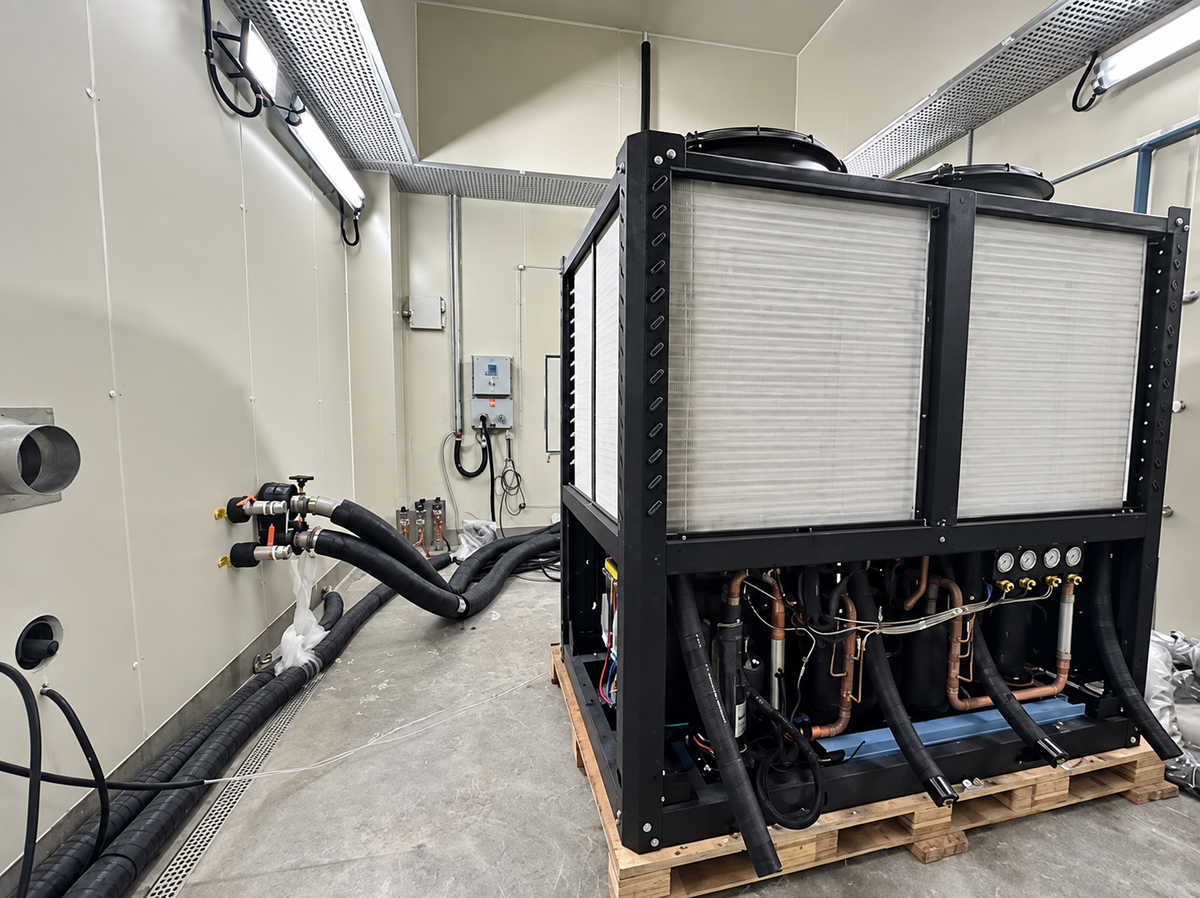 EXINDA air-cooled heat pump connected to test piping inside the climate chamber