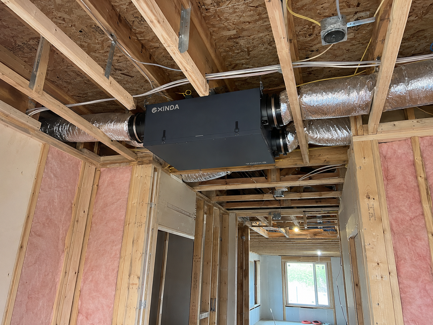 EXINDA Ultra-Slim ERV decentralized ventilation system installed in Manhattan multi-family ceiling plenum retrofit project